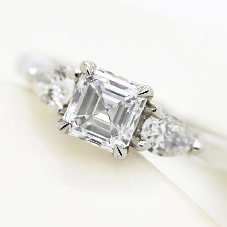 Asscher cut diamond trilogy engagemnet ring