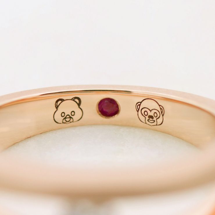 Emoji engraving and ruby signature stone