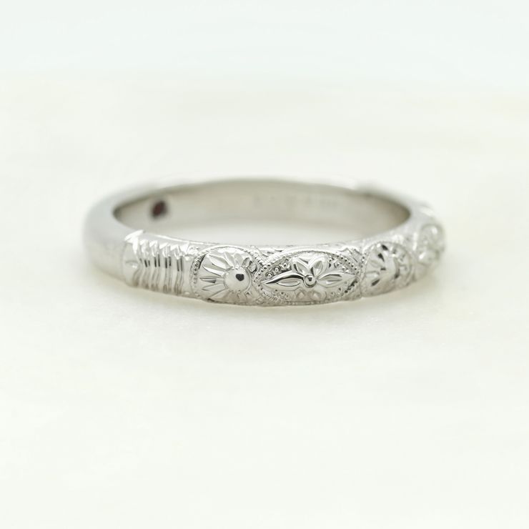 Platinum wedding band with engraving and milgrain