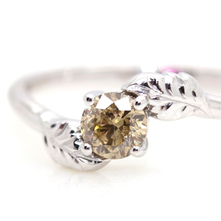 Fancy brown round diamond with leaf engraving on platinum band