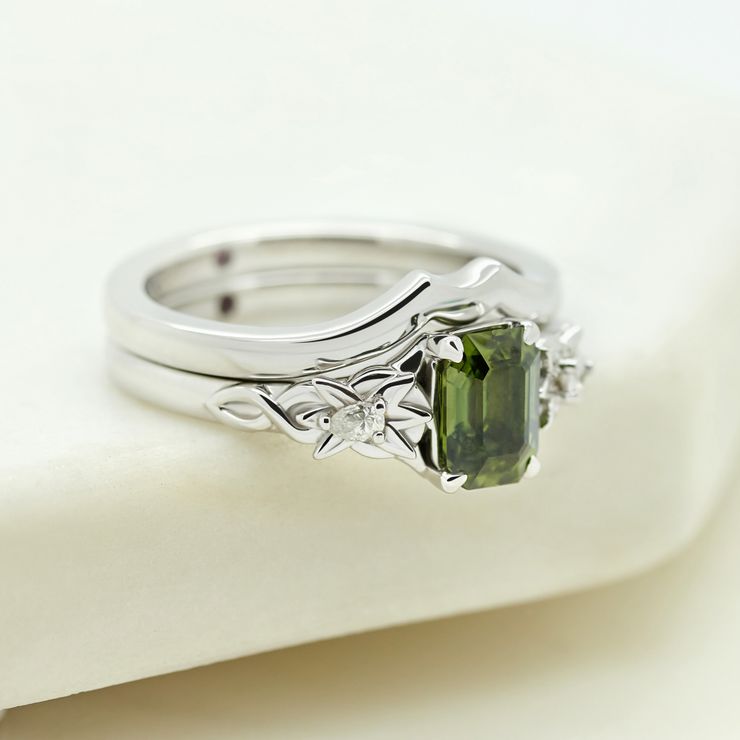 Green sapphire platinum engagement ring leaf details