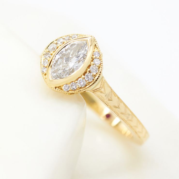Vintage inspired marquise diamond engagement ring with vintage engraving