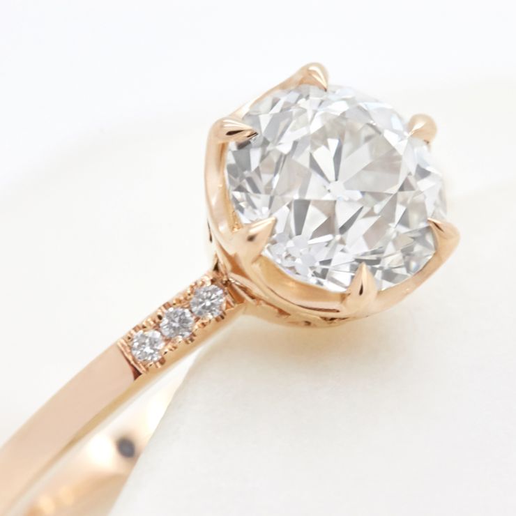 An old mine cut round diamond engagement ring