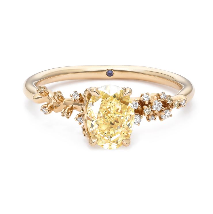 Yellow gold yellow oval diamond with blossom floral inspired diamond pavé 