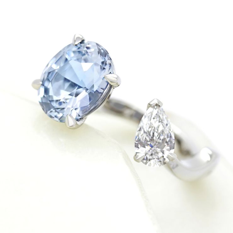 Oval blue sapphire and pear white diamond ring