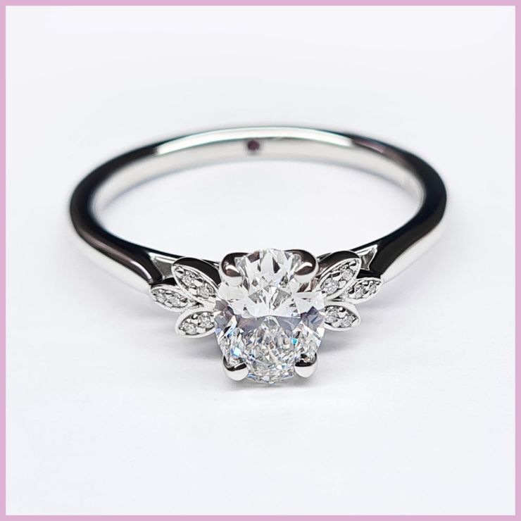 Oval diamond floral engagement ring