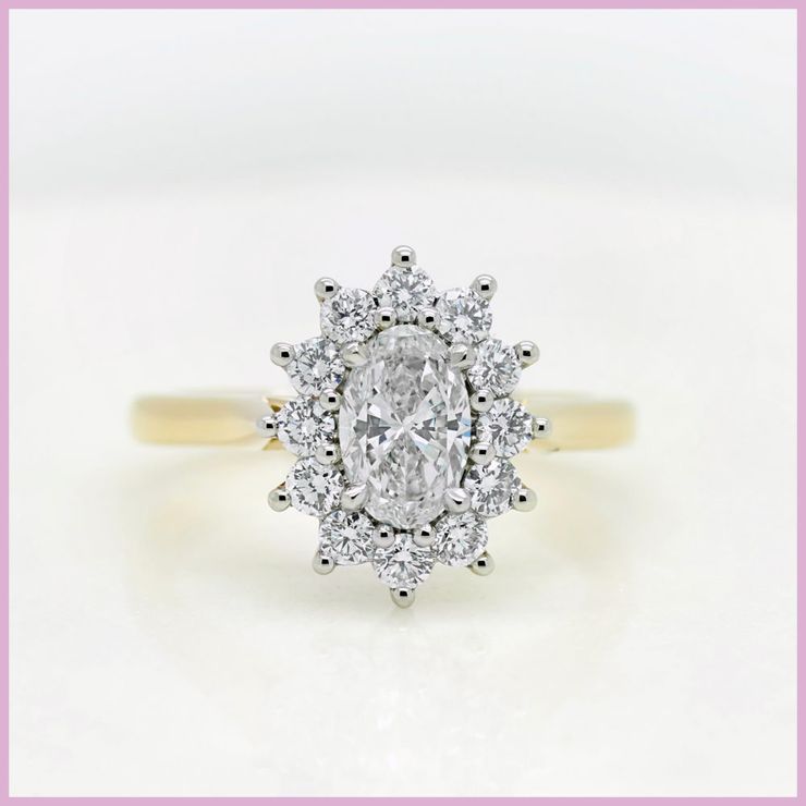 Oval diamond floral halo engagement ring