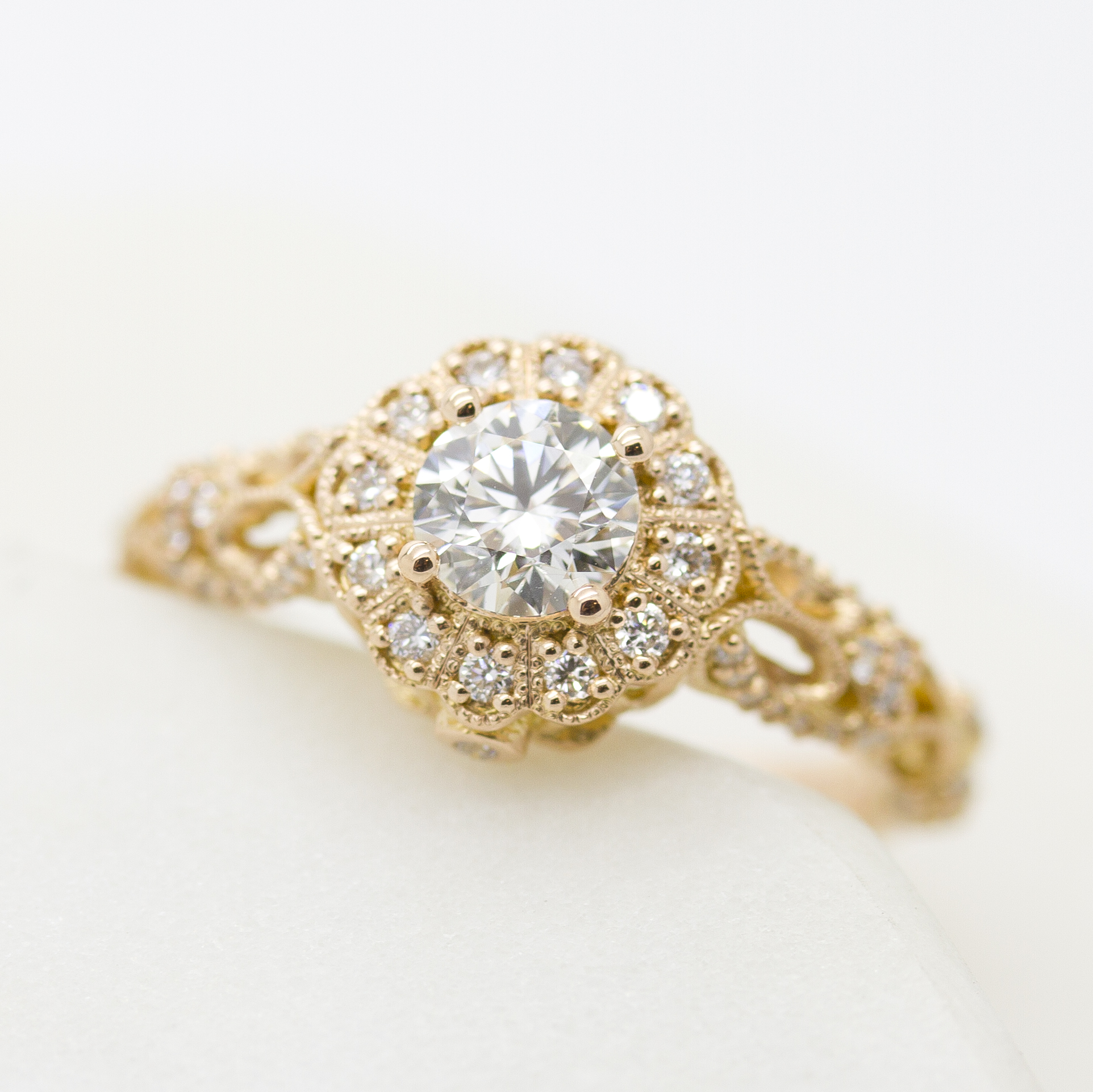 Rose gold milgrain and filigree diamond halo engagement ring