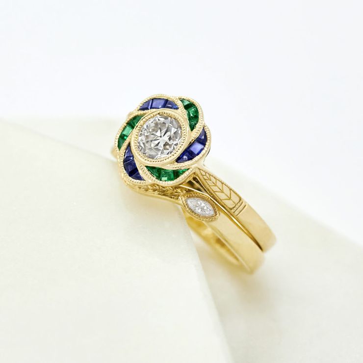 Round diamond emerald sapphire flower halo yellow gold engagement ring