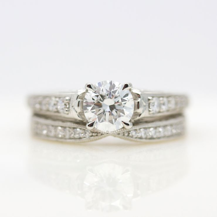 Round diamond with bead set diamond band and matching wedding ring