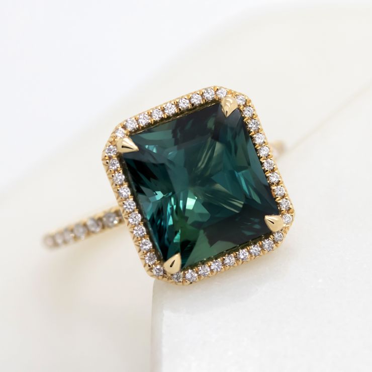 Square dark teal sapphire pave diamond halo yellow gold