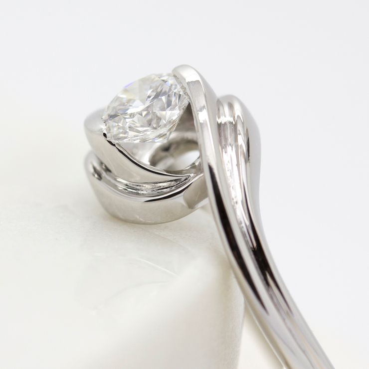 Tension set round diamond engagement ring