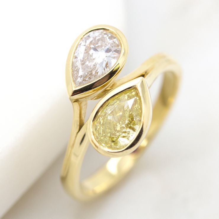 Yellow and white pear cut diamonds in a 'moi et toi' yellow gold engagement ring