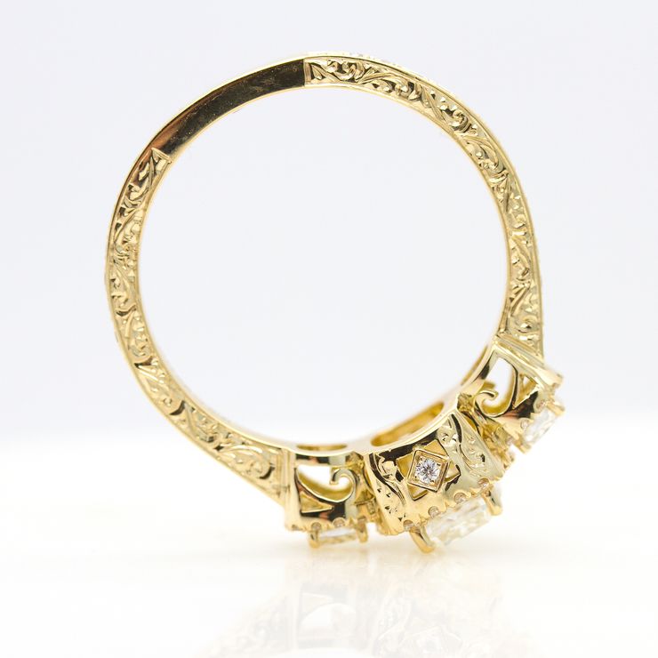 Yellow gold engagement ring with filigree and hand engraving detail