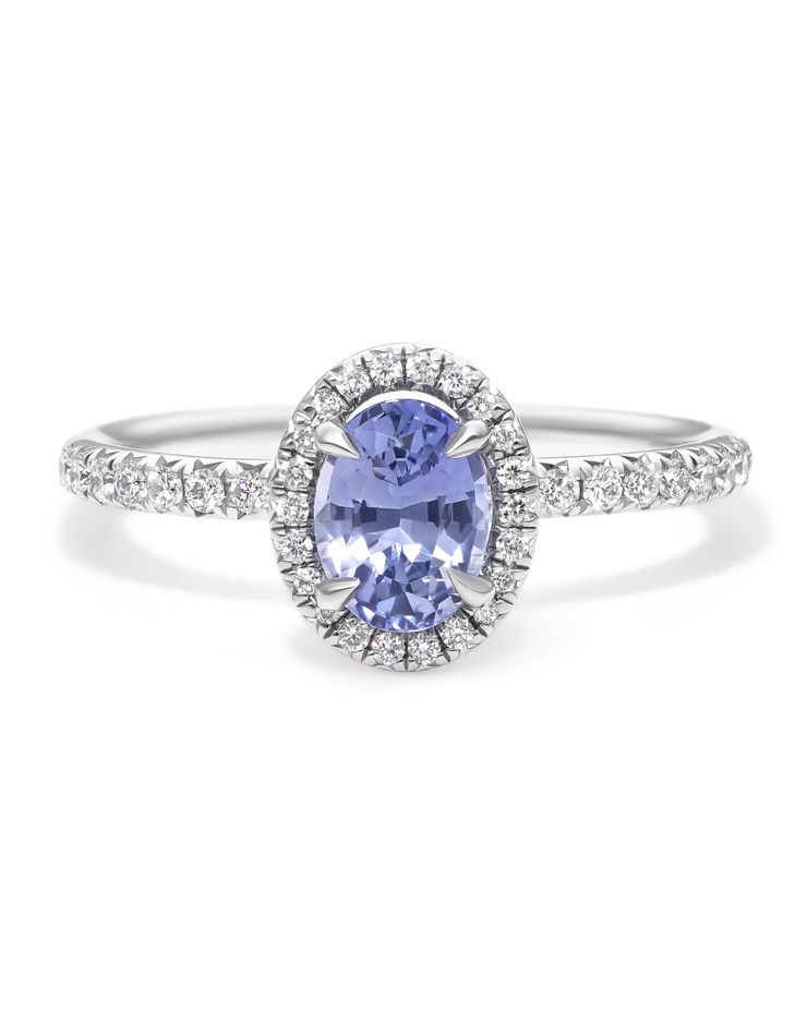 Light blue oval sapphire diamond halo engagement ring