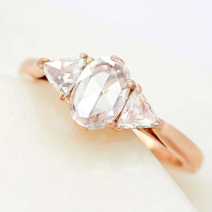 Oval rose cut diamond halo trilogy rose gold engagement ring