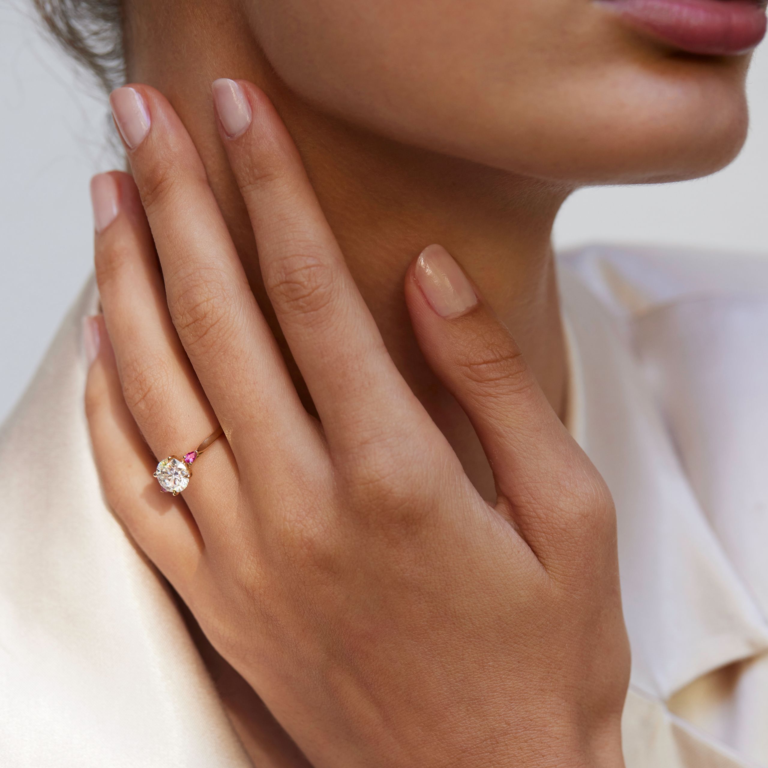 Round faith yellow gold pink sapphires on hand