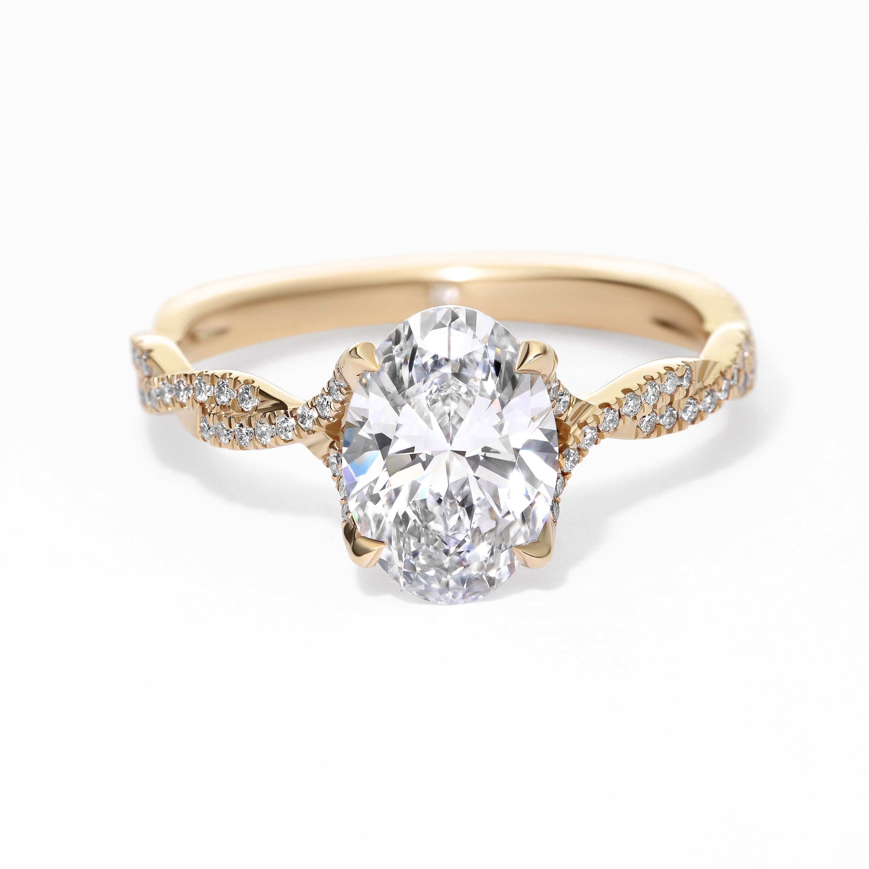 Twisted yellow gold oval diamond engagement ring sq