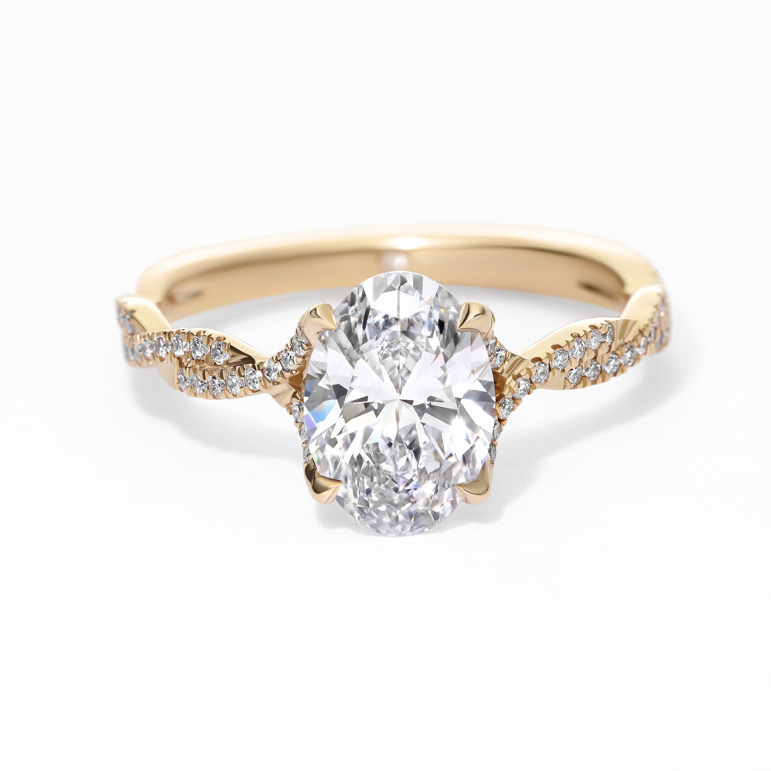Twisted yellow gold oval diamond engagement ring sq