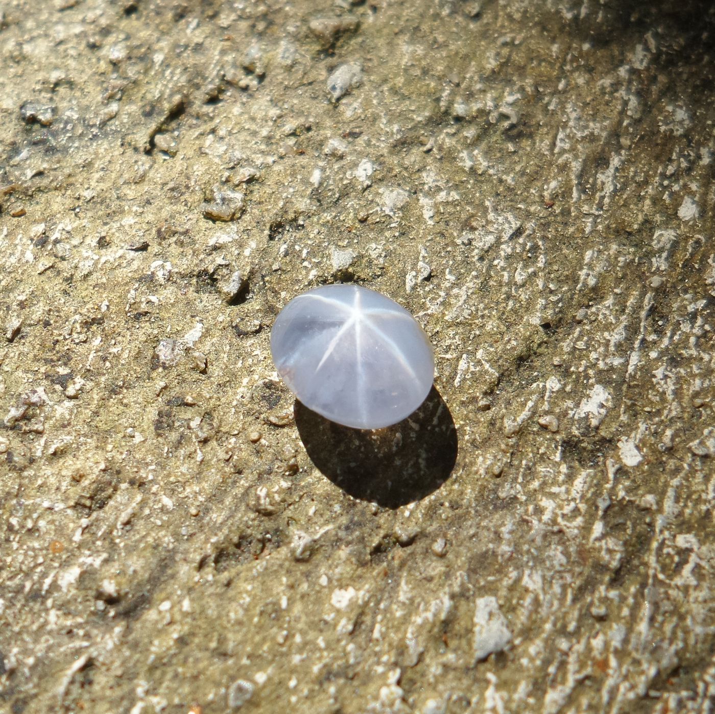 Beautiful natural ceylon blue star sapphire with old cement wall,gemstone background