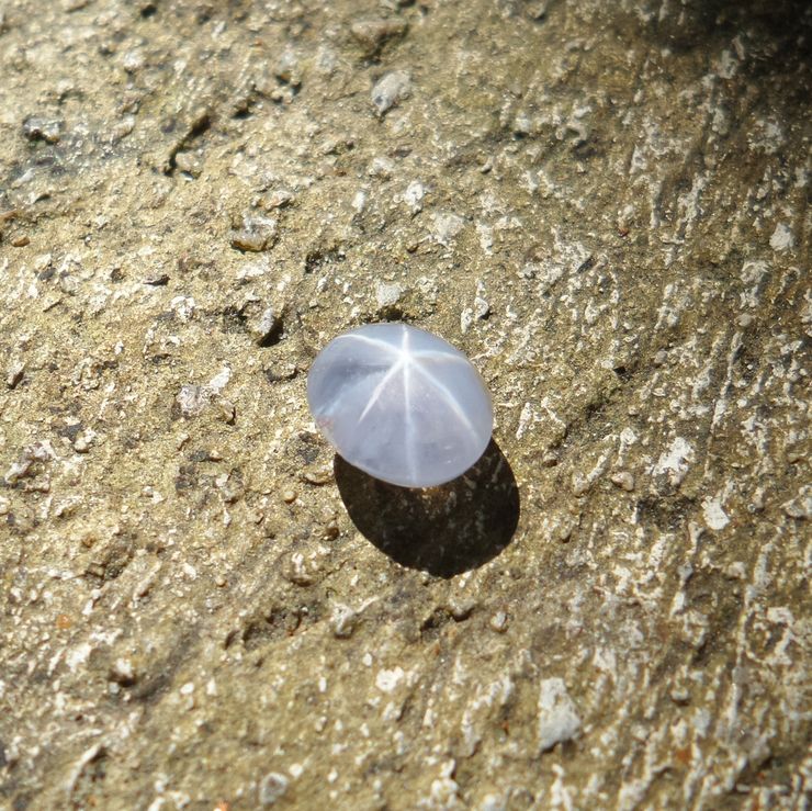 Beautiful natural ceylon blue star sapphire with old cement wall,gemstone background