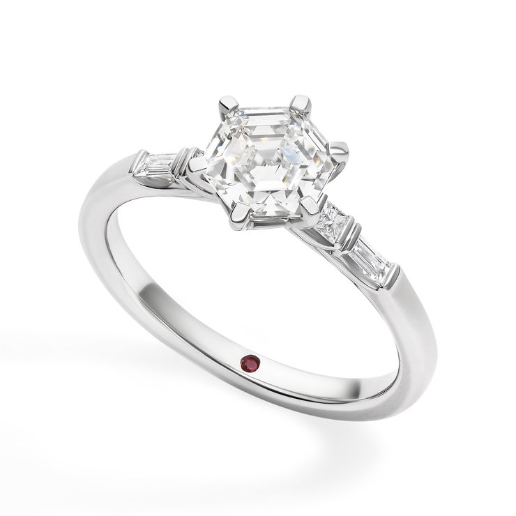 sq hexagonal diamond engagement ring with diamond baguettes along band platinum