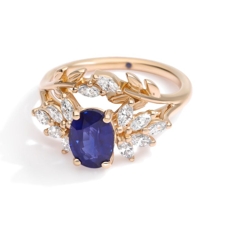 Custom organic yellow gold engagement ring with floral jacket oval pear sapphire with gold leaves sq