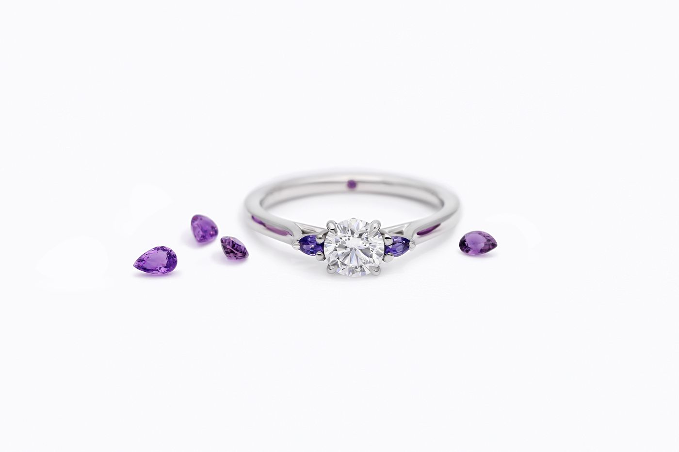Purple pear side stones round diamond centre engagement ring faith