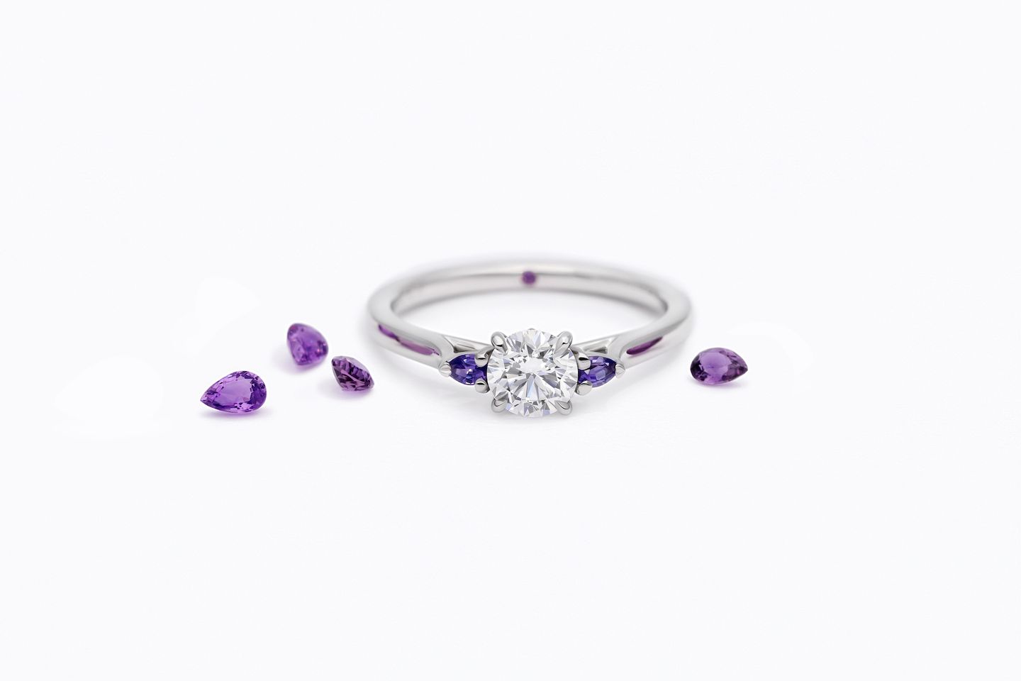Purple pear side stones round diamond centre engagement ring faith