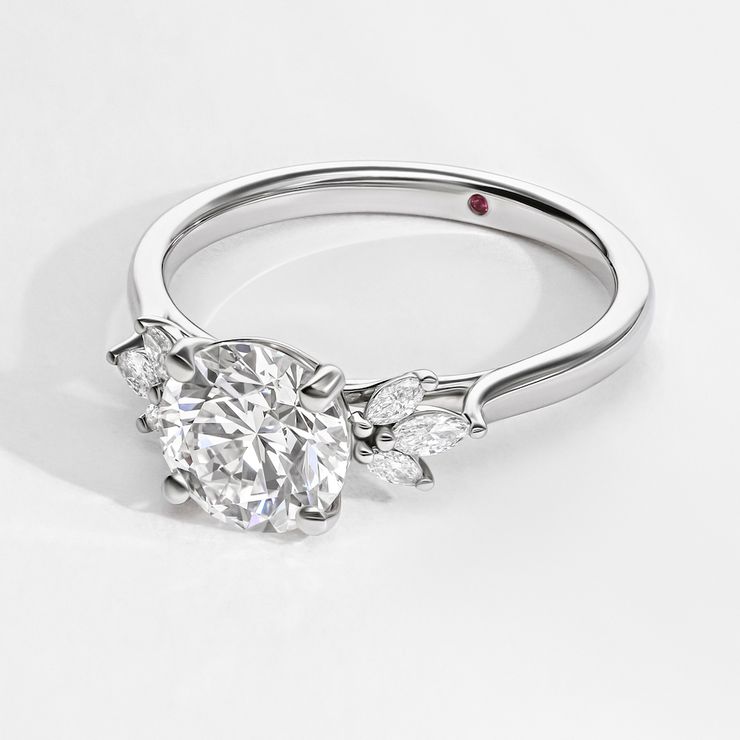 Round diamond platinum nature organic inspired engagement ring with accent petal marquise diamonds