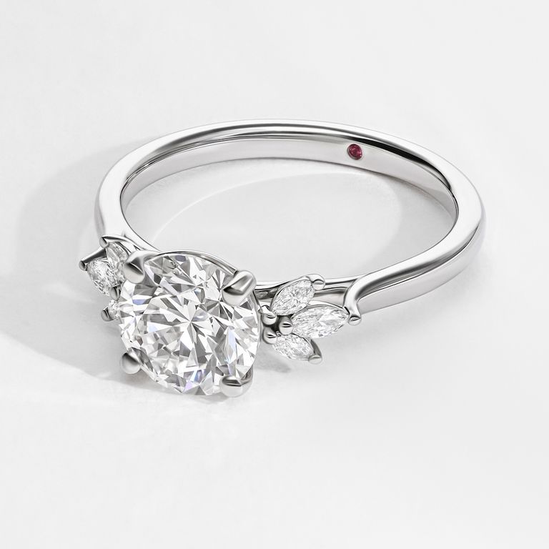 Round diamond platinum nature organic inspired engagement ring with accent petal marquise diamonds