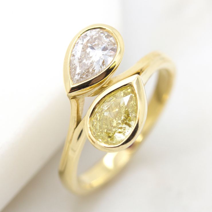 Yellow and white pear cut diamonds in a 'moi et toi' yellow gold engagement ring