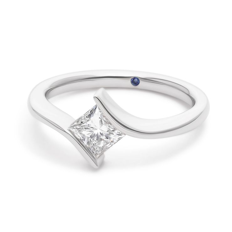 Custom asymmetric platinum sculptural engagement ring with princess cut diamond centre