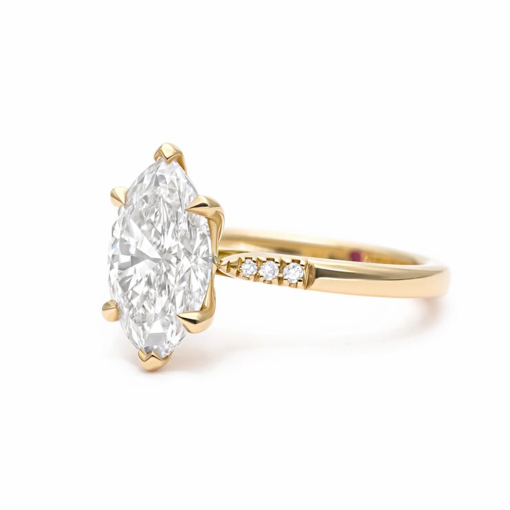 Marquise diamond engagement ring yellow gold pave side band