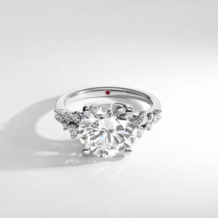I want a round brilliant diamond in platinum, that scatters light across a room.
