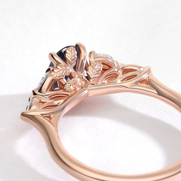 I want a setting that looks like the rose gold was trained to grow around the centre stone like foliage.