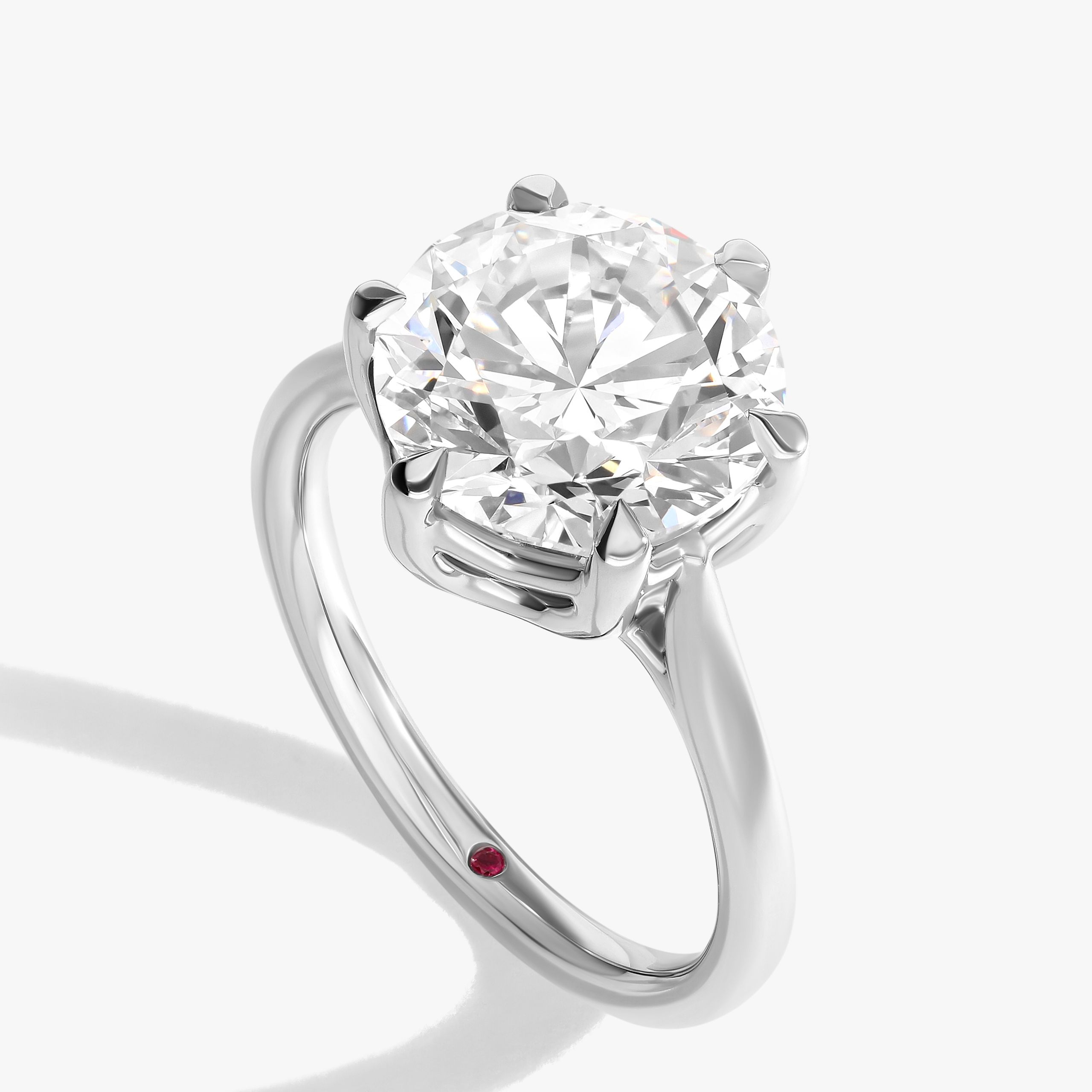 I want a round diamond that speaks for itself, with nothing to distract from it.