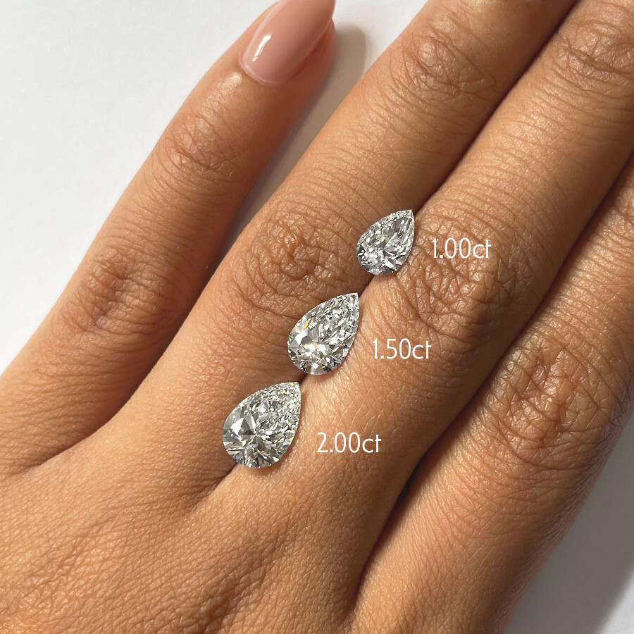 Demure Pear Cut Solitaire Platinum Engagement Ring • Taylor Hart