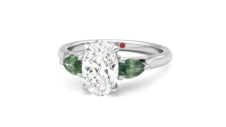 Diamond ring with on sale emerald side stones